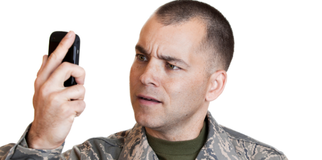 Veteran in uniform with phone